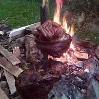 pig hocks over a fire