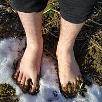 Barefoot in snow and mud