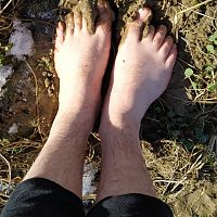 Barefoot in squishy farm mud