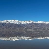Death Valley lake reflecting Panamint Mountains